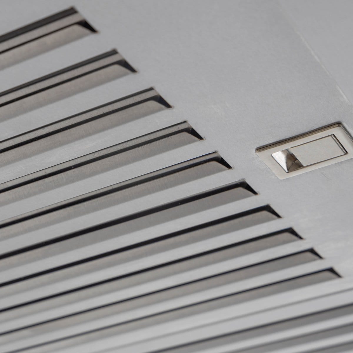 Close-up of a ProlineRangeHoods.com Stylish Ductless Stainless Steel Wall Mounted Range Hood, 600 CFM, ideal for kitchens.