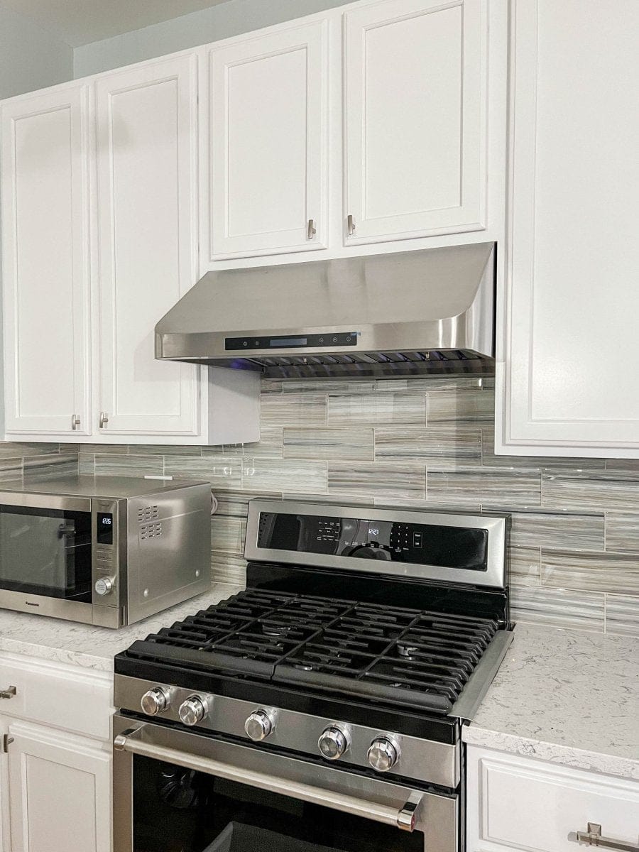 Contemporary kitchen with ProlineRangeHoods.com high-performance ventilation, a Proline PLFW 115 Hood, and sleek finishes.