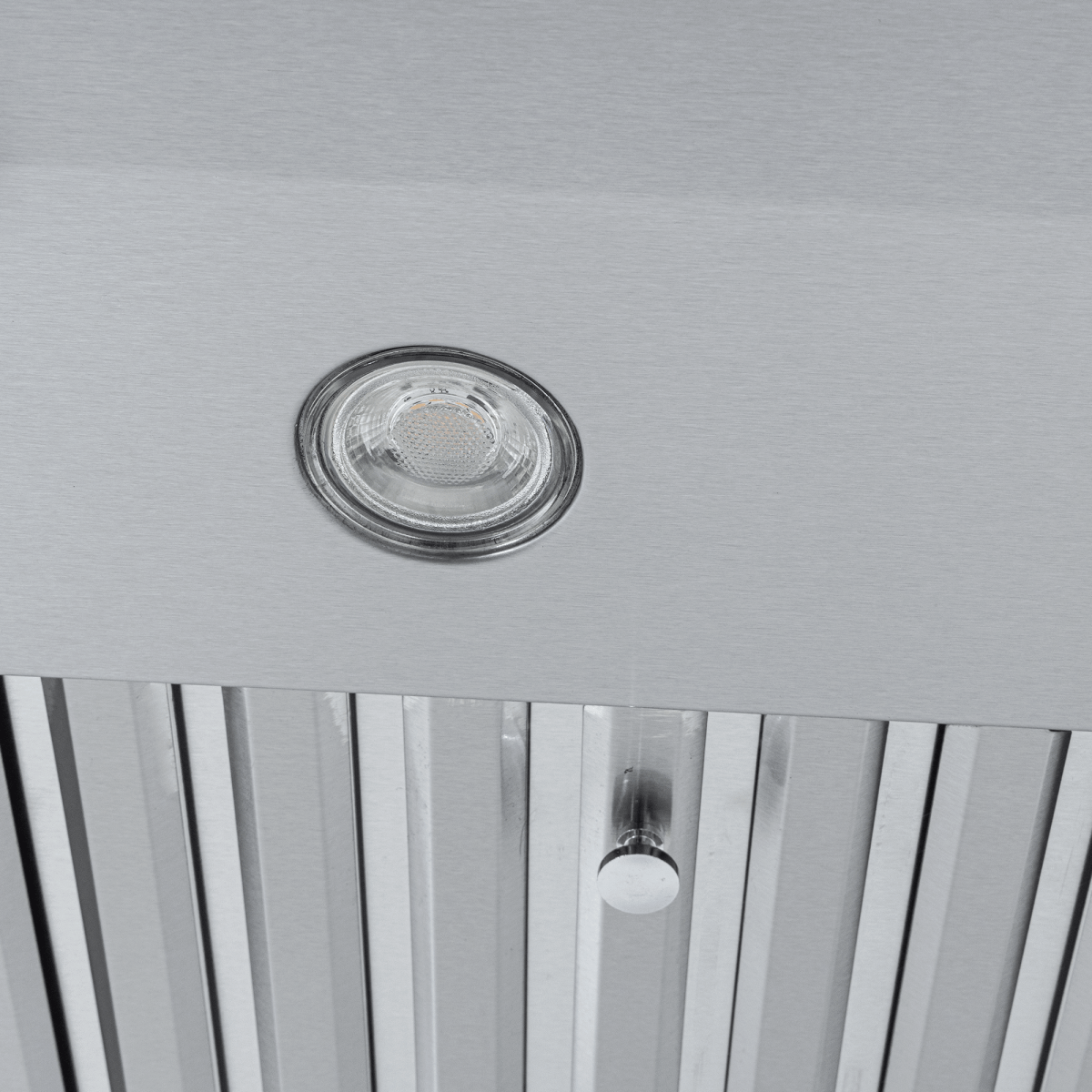 Close-up of Proline PLJW 117 range hood, stainless steel, round light, slats, 900 CFM; ductless. ProlineRangeHoods.com.