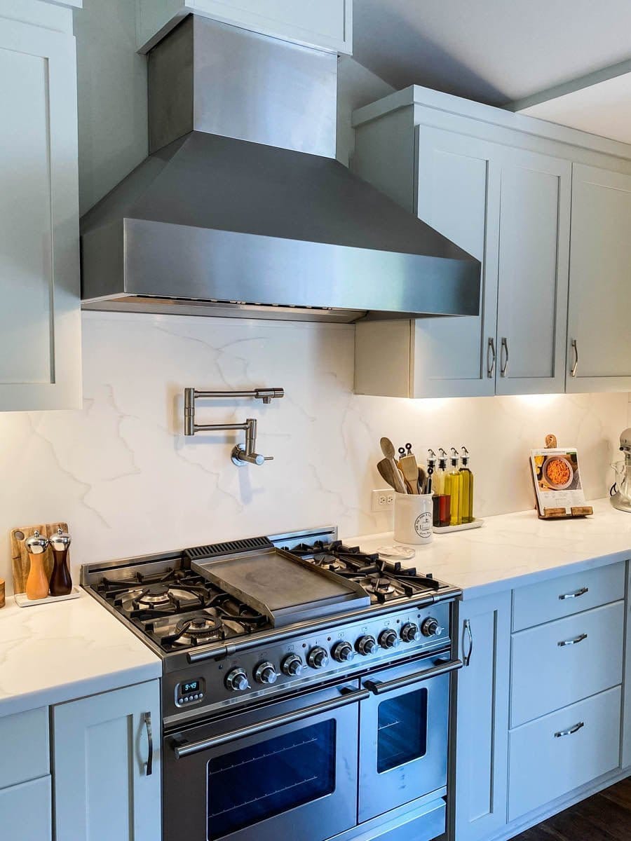 Modern Wall-Mounted Stainless Steel Range Hood by Proline ProVWC Installed in a Modern Kitchen Over a Gas Stove