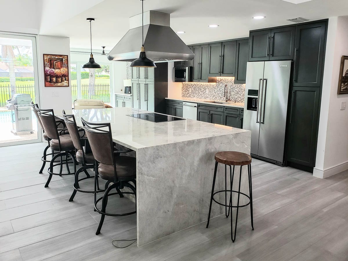 Contemporary kitchen with ProlineRangeHoods.com marble island bar stools and a Proline PLJI 109 Island Range Hood, 1200 CFM.