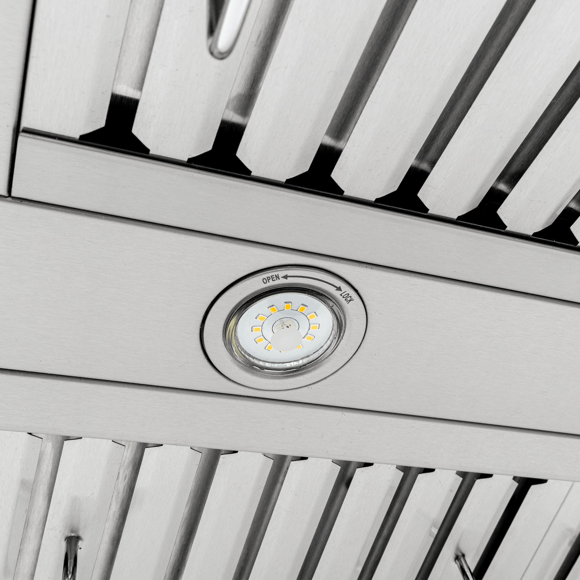 Close-up of Proline PLFW 755 range hood with circular light, stainless steel, 1100 CFM. ProlineRangeHoods.com.
