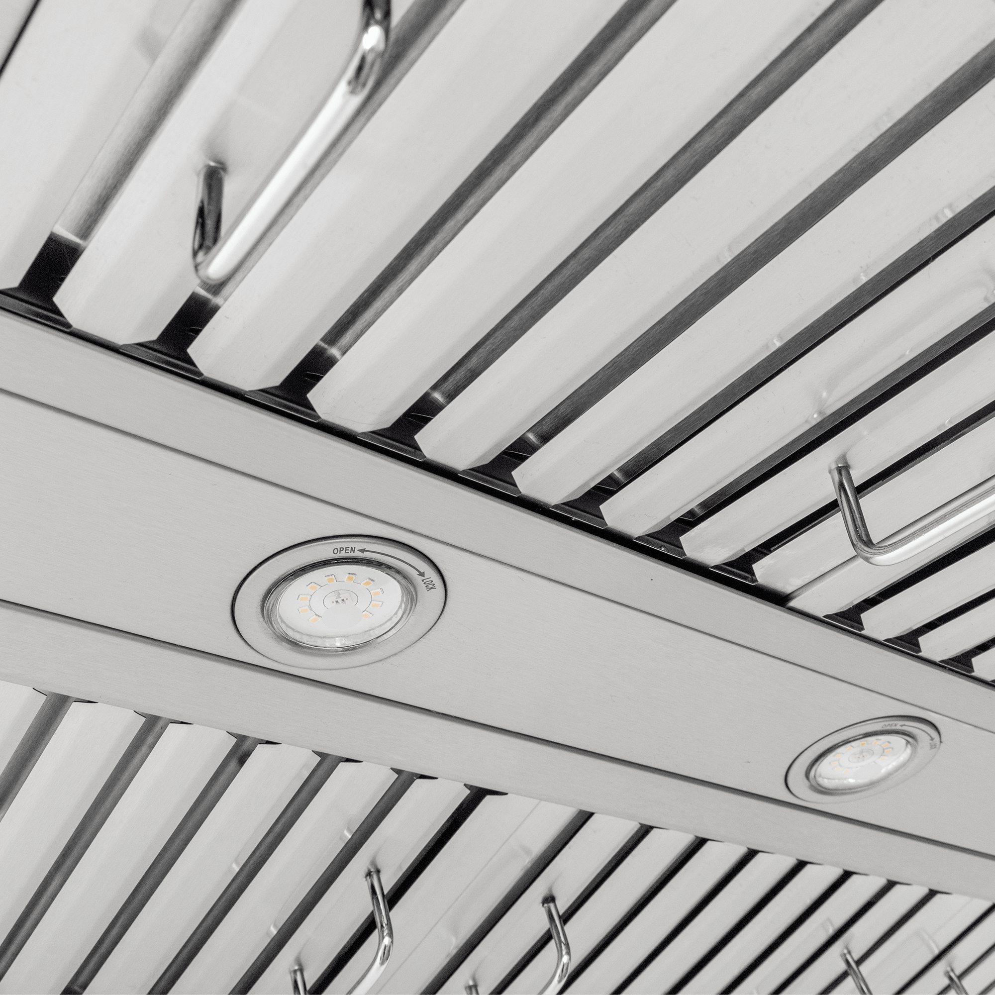 Close-up of Proline PLFW 755 range hood: stainless steel, slatted vents, dual motors, 1100 CFM. ProlineRangeHoods.com.
