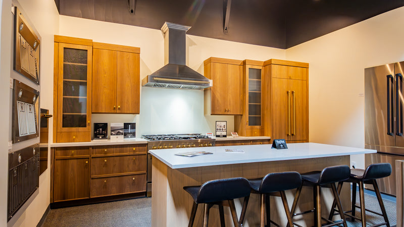 Warm wood kitchen with ZLINE range and island seating