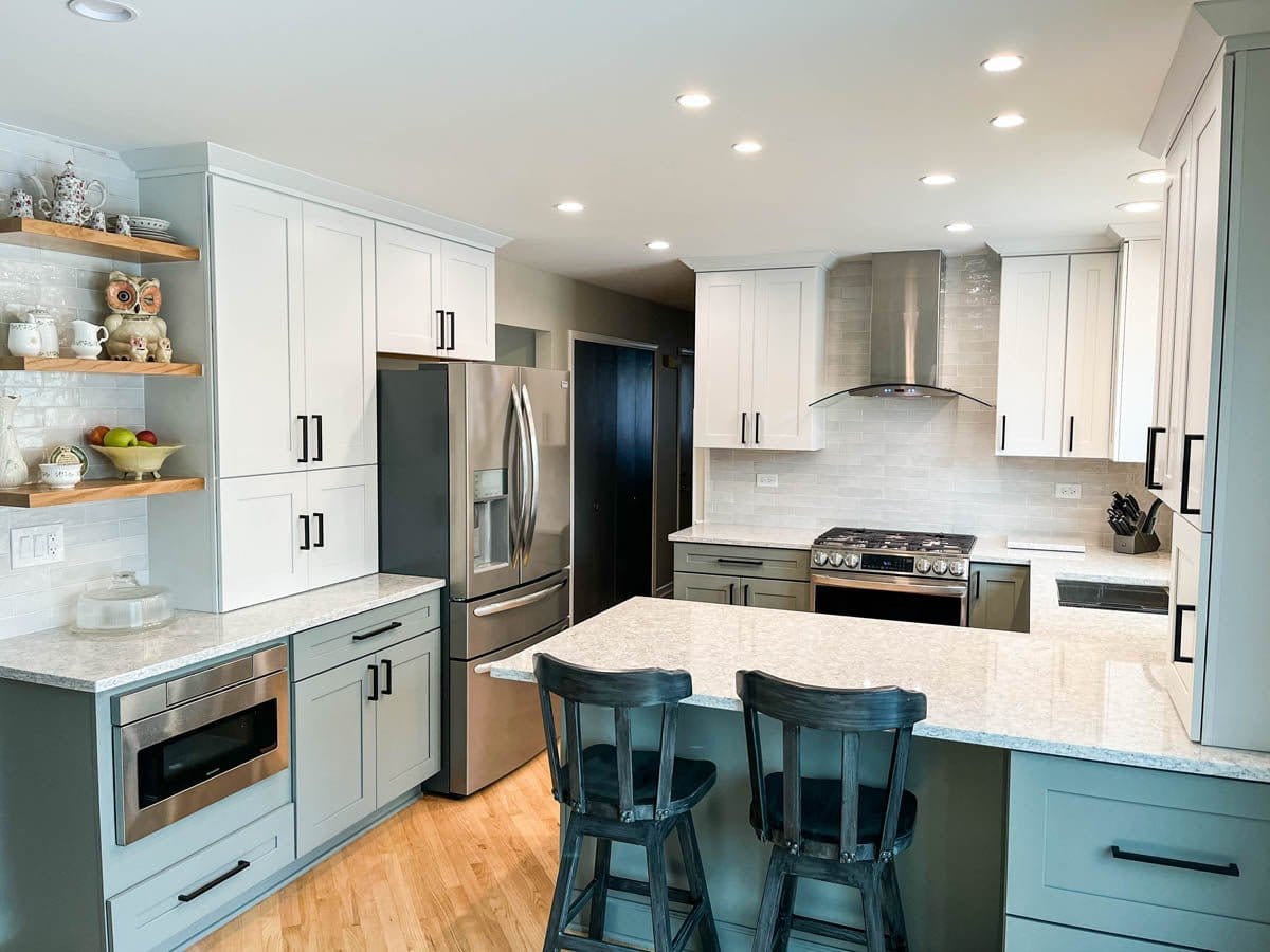 Modern kitchen: grey cabinets, steel appliances, island, open shelves, Proline PLFW 544 range hood. ProlineRangeHoods.com.